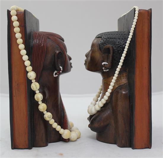 Ivory elephant on stand, a pair of bookends and two ivory bead necklaces